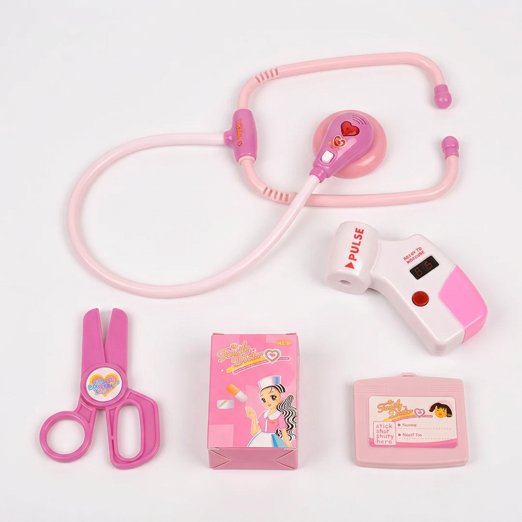Pink doctor kit accessories arranged on white